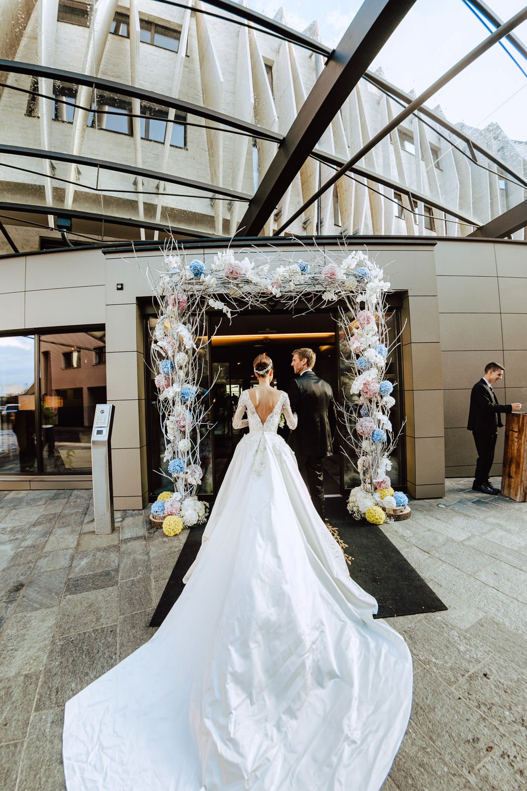 bride groom entering alpina dolomites hotel