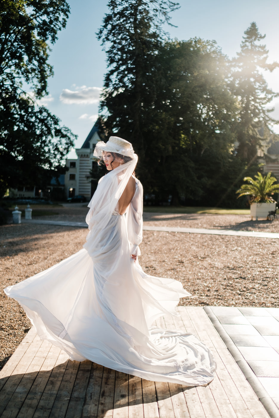 bride with hat at chateau challain